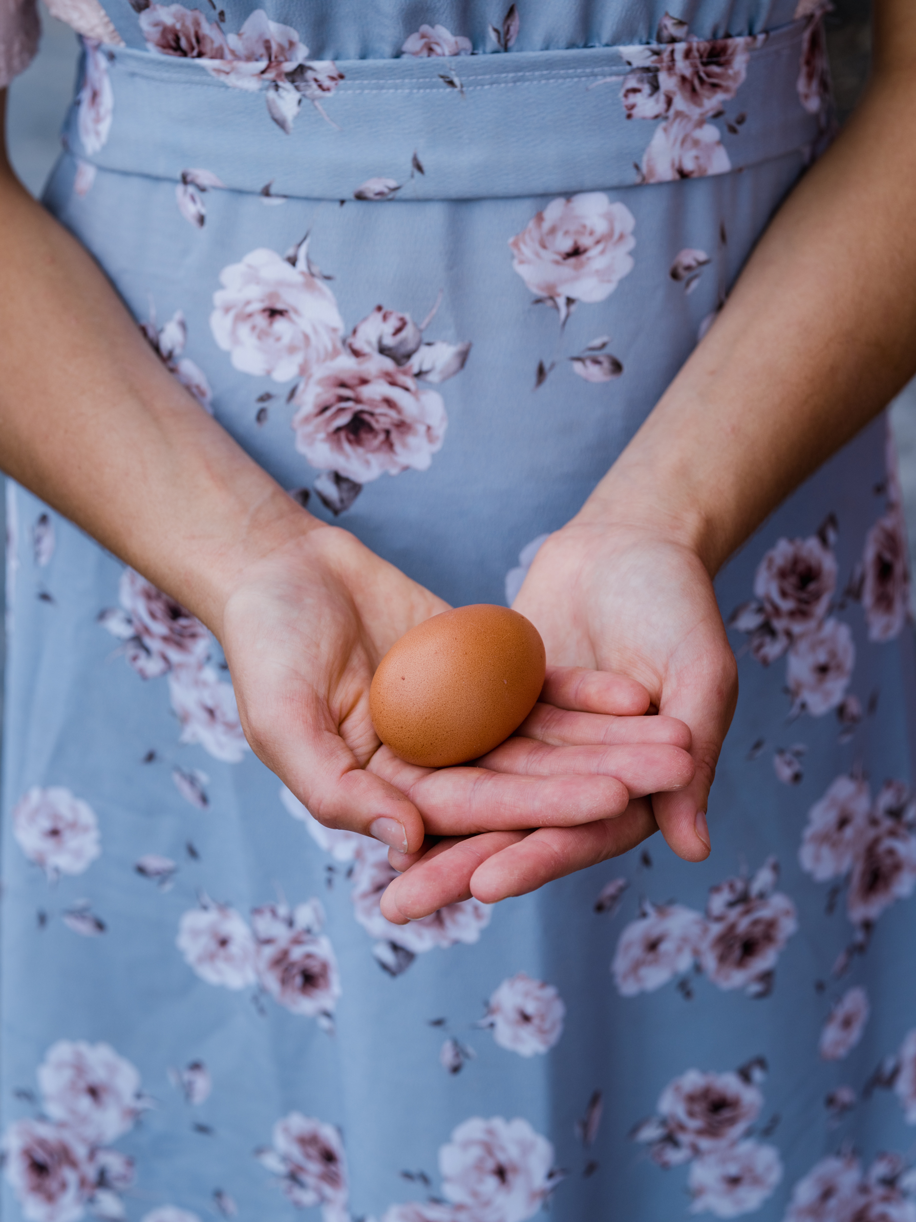 Woman holding egg image